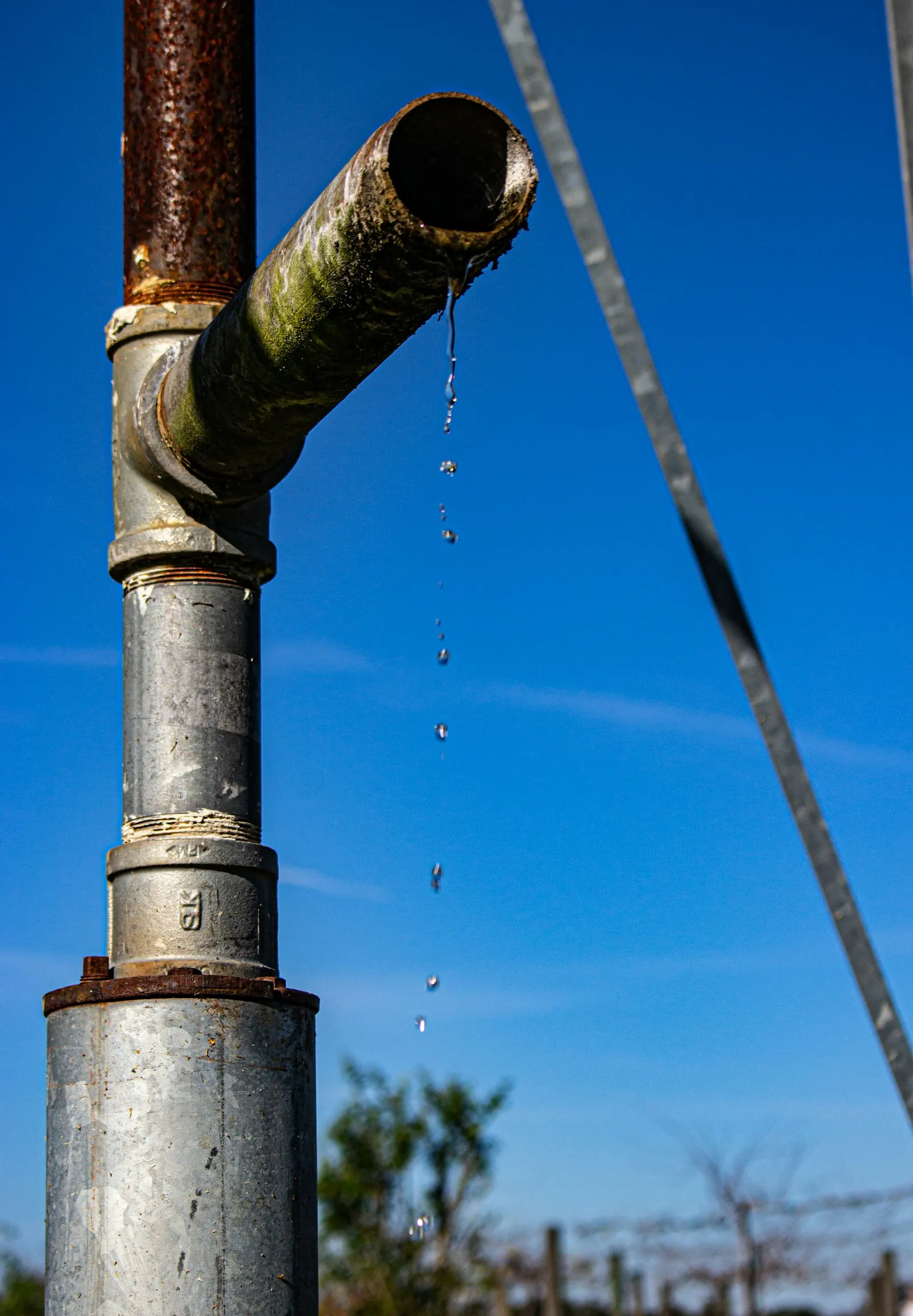 Water dripping from a leaking pipe joint